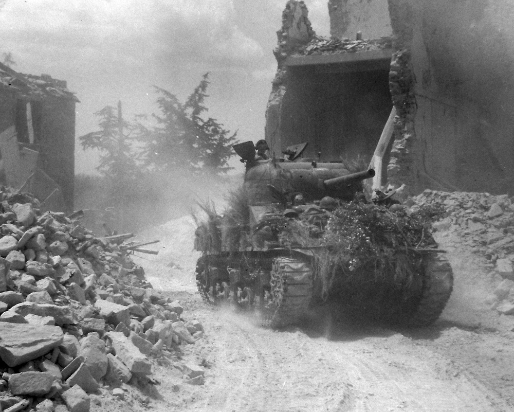 An Ontario Regiment tank enters San Pancrazio. Alexander M. Stirton/ DND / Library and Archives Canada / PA-160448