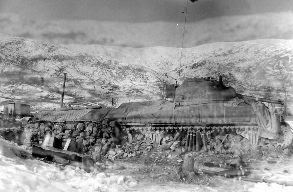 Stationary tank in the mountains of Italy
Although this photo is from Jan 1945, the situation in December 1944 looked exactly the same.
Photo by Lieutenant Daniel Guravich. Library and Archives Canada, PA-173546